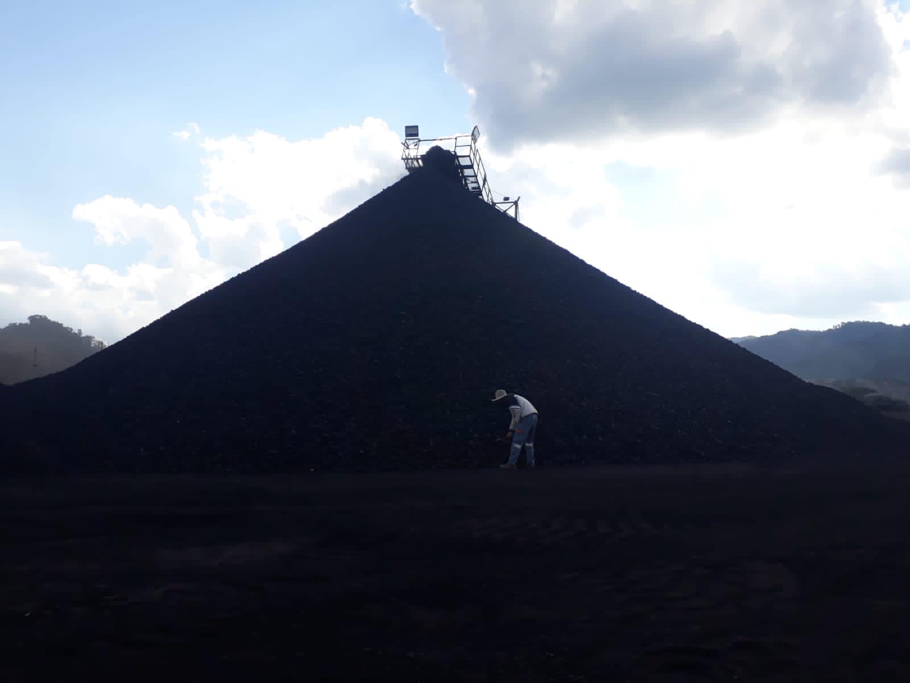 Coal stockpile at sunset